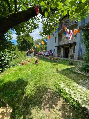 a yard with flags hanging from a building at Villa Pontica in Sofia