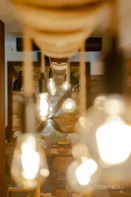 a blurry picture of a room with lights at 103 Alpine Hotel in Panichishte