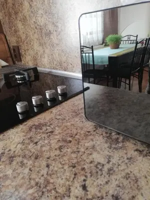 a room with a mirror and a table with a dining room at Приключение в Триград in Trigrad