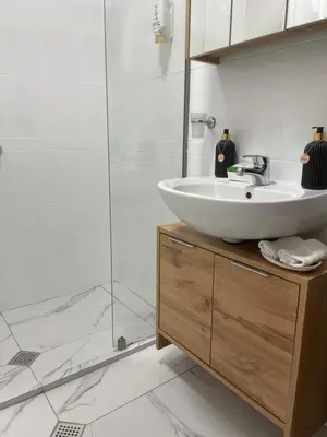 a bathroom with a sink and a shower at Paradise in the Mountain in Bansko