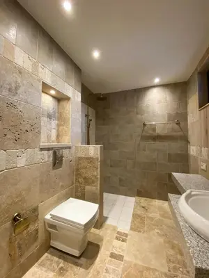 a bathroom with a toilet and a sink at Къща за гости Volpe - Volpe Guesthouse in Oreshak