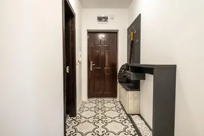 a hallway with a door and a tile floor at Bendida Central in Velingrad