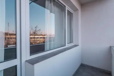 an empty room with a window with a view at Industrial 2-BDR Flat by the National Stadium by Flat Mаnager in Sofia