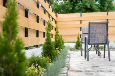 a sign in a garden next to a building at Villa Pino in Velingrad