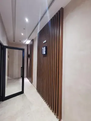 a hallway with a door and a wall with a mirror at Niko's Cozy Apartment in Plovdiv