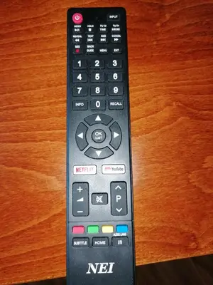 a remote control sitting on top of a table at iVAVev CedarLodge Bansko in Bansko