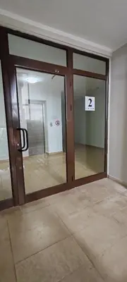 an empty room with a sliding glass door with at iVAVev CedarLodge Bansko in Bansko