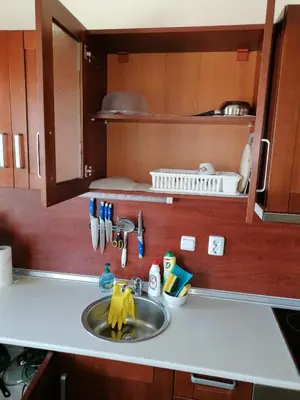 a kitchen counter with a sink in a kitchen at iVAVev CedarLodge Bansko in Bansko