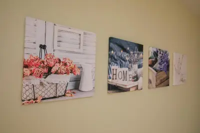four pictures on a wall with flowers and a window at Feel at Home in Sandanski
