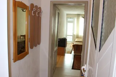 a hallway with a door leading to a room at Orchideia Studios in Sandanski