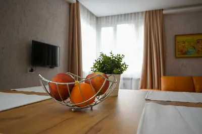 a bowl of fruit on a table in a hotel room at Roza Home in Sofia