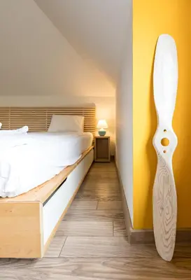 a bedroom with a bed and yellow walls at Park Loft next to Eagle's Bridge in Sofia
