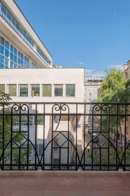a black metal gate in front of a building at Semiramis` Suite 2-bedroom Lux Apartment in Sofia
