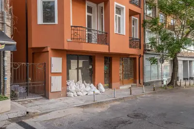 a building with a bunch of shoes in front of it at Semiramis` Suite 2-bedroom Lux Apartment in Sofia
