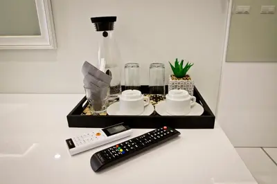 a remote control sitting on a counter next to a remote control at Plovdiv City Center Hotel in Plovdiv