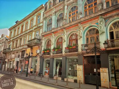 a row of buildings on a city street at Art apartment EVMOLPIAS near Roman stadium in Plovdiv