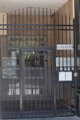 an open gate in front of a building at Landmark Apartment in Sofia