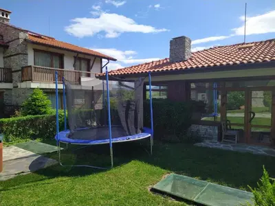 a swing in the yard of a house at Вила Магдалена, к-с Александриа in Dobrinishte