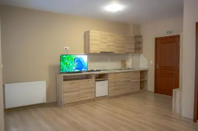 a kitchen with a desk with a fish tank on it at Вила Влахов in Sapareva Banya