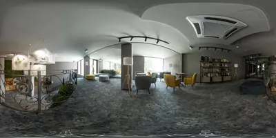 a room with a library with chairs and a table at The Five Elements Hotel and SPA in Sapareva Banya
