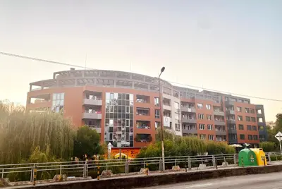a large apartment building in front of a building at Irina Apartment in Sandanski