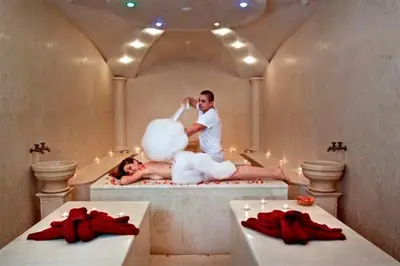 a man and a woman in a bath tub at Grand Monastery Private Apartment in Pamporovo