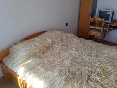a bed with a pile of hair on top of it at Katya Guest House in Smolyan