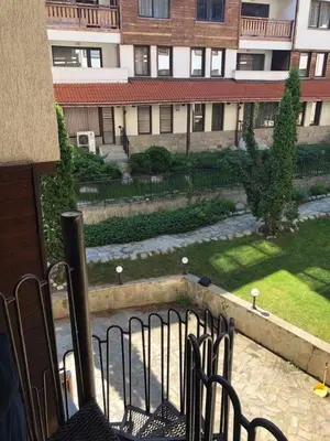 an outside view of a building with a courtyard at GONDOLAs LODGE in Bansko