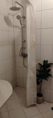 a shower with a shower curtain in a bathroom at GONDOLAs LODGE in Bansko