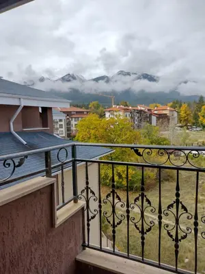 a balcony with a view of the mountains at Apartment BanskoIN in Bansko