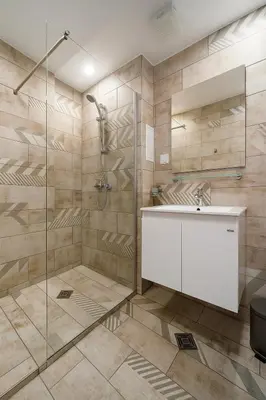 a bathroom with a shower and a sink at North Panoramic Apartment in the art district of Kapana in Plovdiv