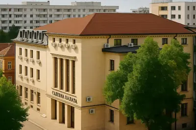 a building with a sign on the side of it at North Panoramic Apartment in the art district of Kapana in Plovdiv