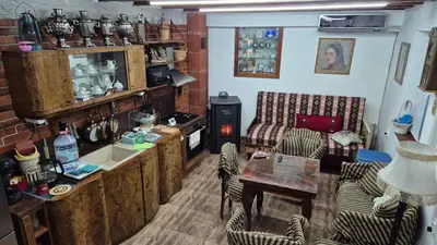 a living room with a couch and a table at Modern and Old LODGE in Sofia