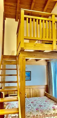 two bunk beds in a room with a bed at Pirin Golf Hotel Private Apartments Апартаменти Планински Изгрев в Пирин Голф in Razlog