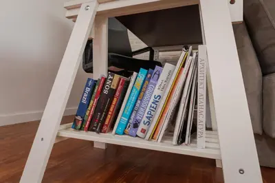 a book shelf filled with books next to a couch at 2BD Flamingo Flat with Balcony in Sofia Center by Flat Mаnager in Sofia