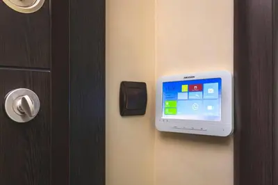 a door with a television attached to a wall at Cozy new Apartment 'Casa Vacanza ' ✵ TOP CENTER ✵ in Plovdiv