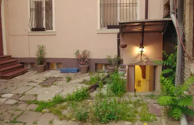 a courtyard with potted plants in front of a building at Top Center Detached Apartment Studio in Sofia