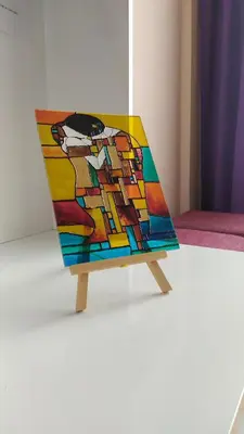 a chair with a painting on the back of it at Lovely City Center 1BD, 1BT Apartment in Sofia