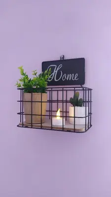 a black shelf with plants and a sign on it at Lovely City Center 1BD, 1BT Apartment in Sofia