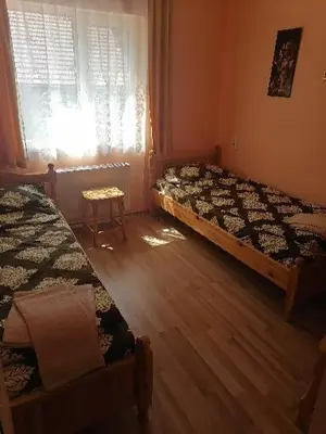 a bedroom with two beds and a window at Guest House Shipkovo Hills in Shipkovo