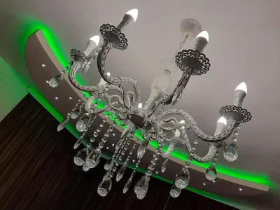a chandelier is hanging from a ceiling at Вила Мая 2 in Krayni Dol