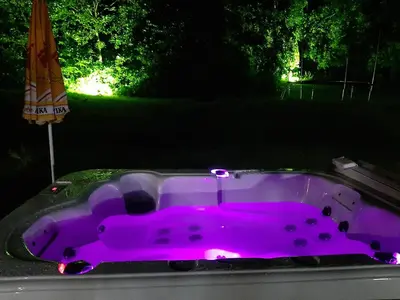 a purple bath tub in a yard at night at Вила Мая 2 in Krayni Dol
