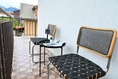 two chairs and a table on a patio at Discovery Apartment Bansko in Bansko