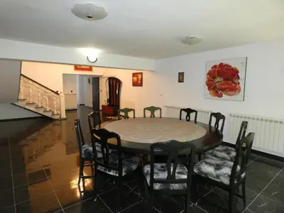 a dining room with a table and chairs at Grande - Velingrad in Velingrad
