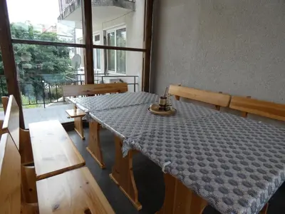 a table in a room with a table cloth on it at Grande - Velingrad in Velingrad