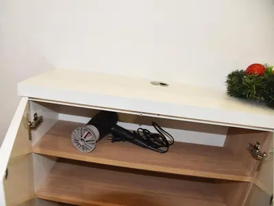 a cabinet with a white counter top and aumption at Borovets Gardens Luxury apartment E11 in Borovets