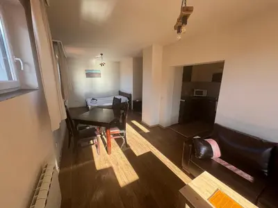 a small room with a table and chairs and a dining room at Bansko Royal Towers - Studio 153 in Bansko