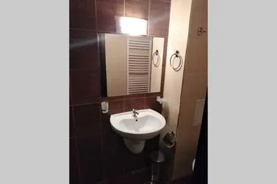 a bathroom with a sink and a mirror at Bansko Royal Towers - Studio 1237 in Bansko