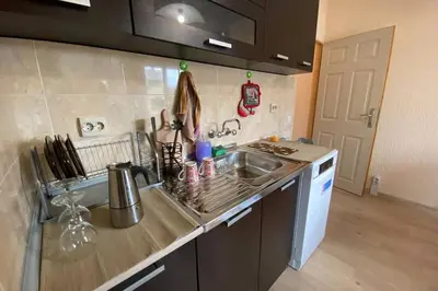 a kitchen with a sink and a counter top at Sunny apartment by the river in Sandanski