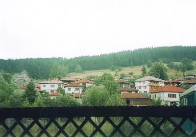a view of a town from behind a fence at Янко Кехая in Koprivshtitsa